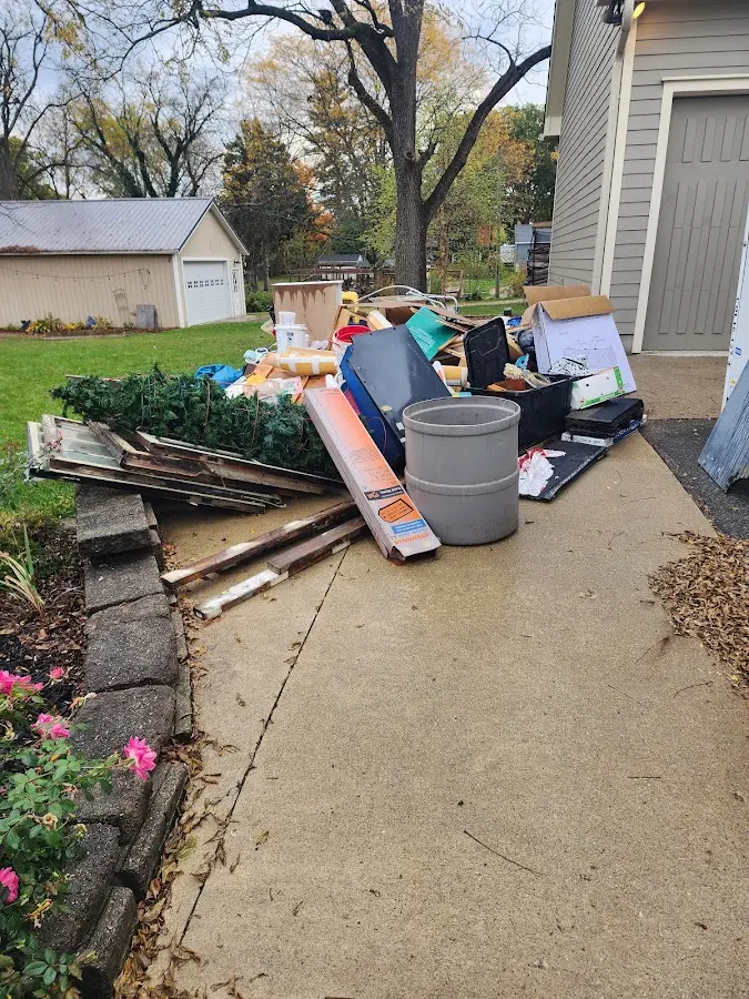 Dumpster being loaded with debris for 3 Yard Dumpster Rental in Kenner